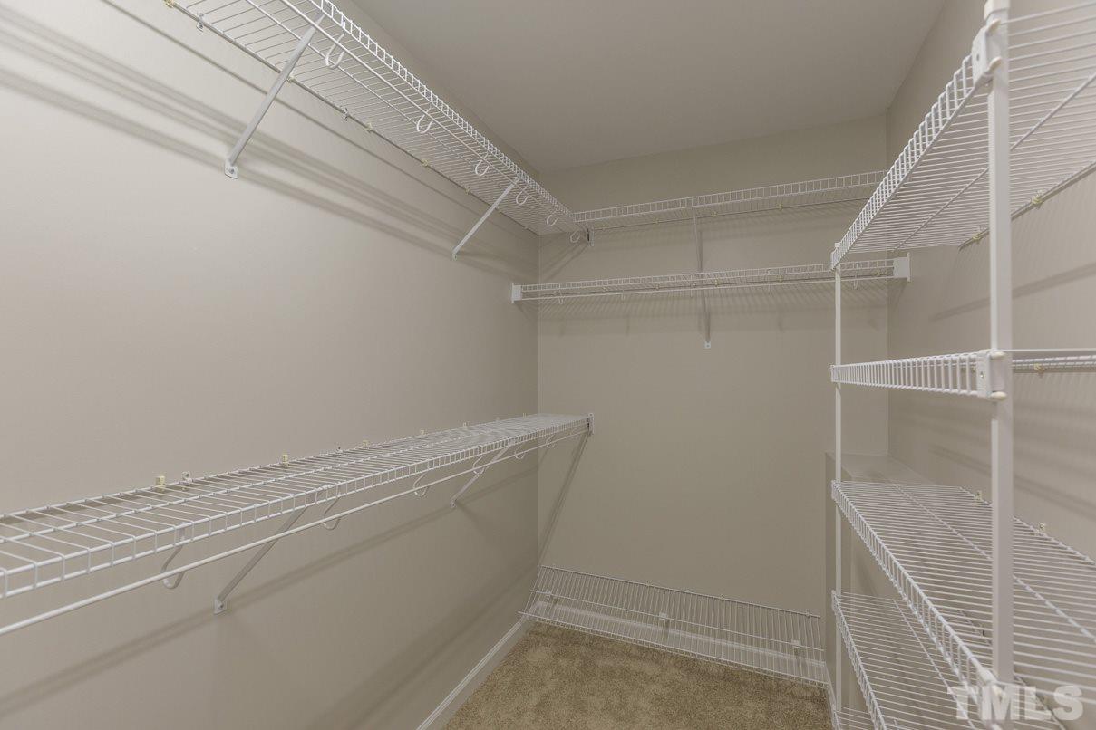 826 Shackleton Road Apex, NC 27502 - Photo 20 of 24 a view of a room with racks on the wall