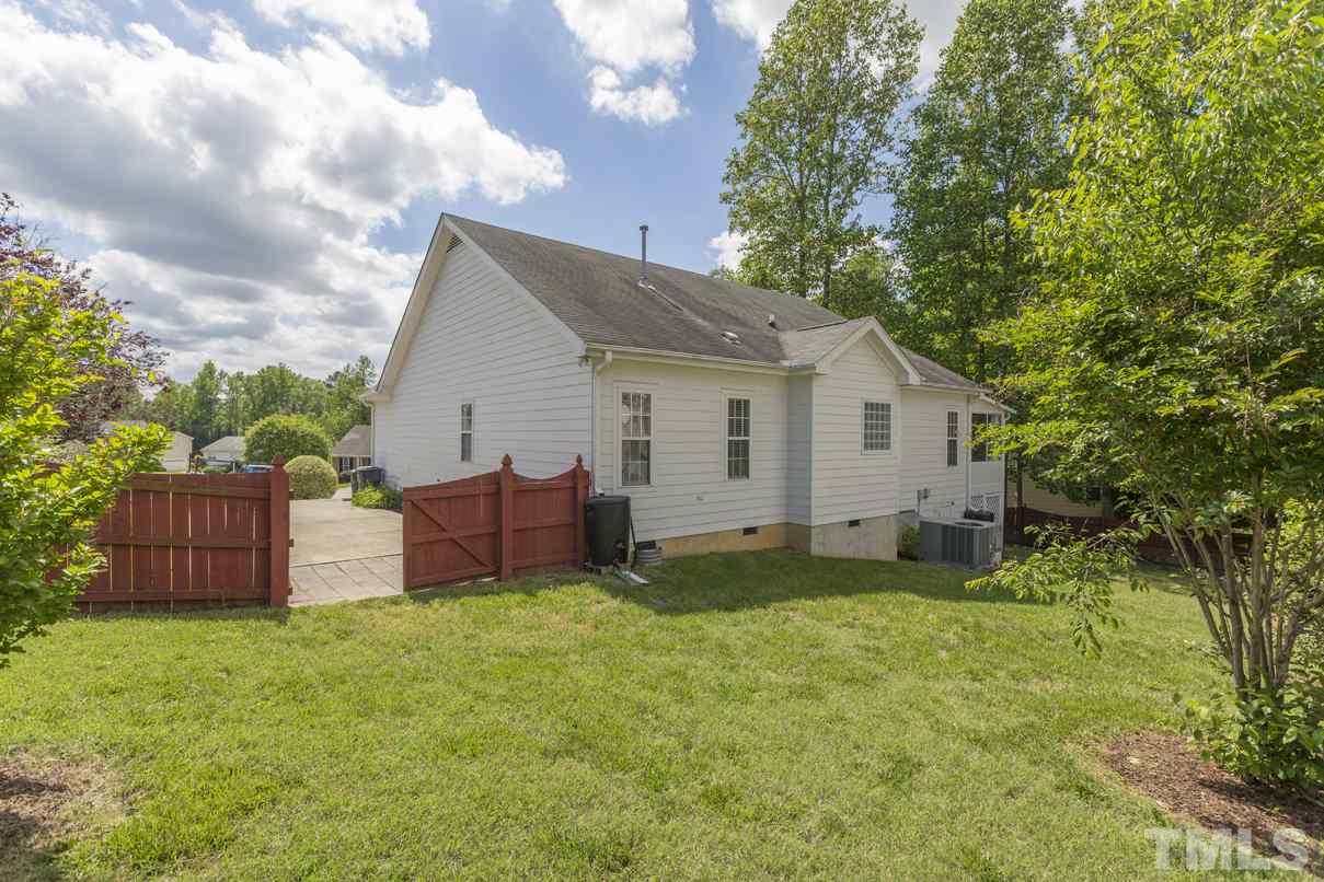 826 Shackleton Road Apex, NC 27502 - Photo 23 of 24 a view of a house with a yard and plants