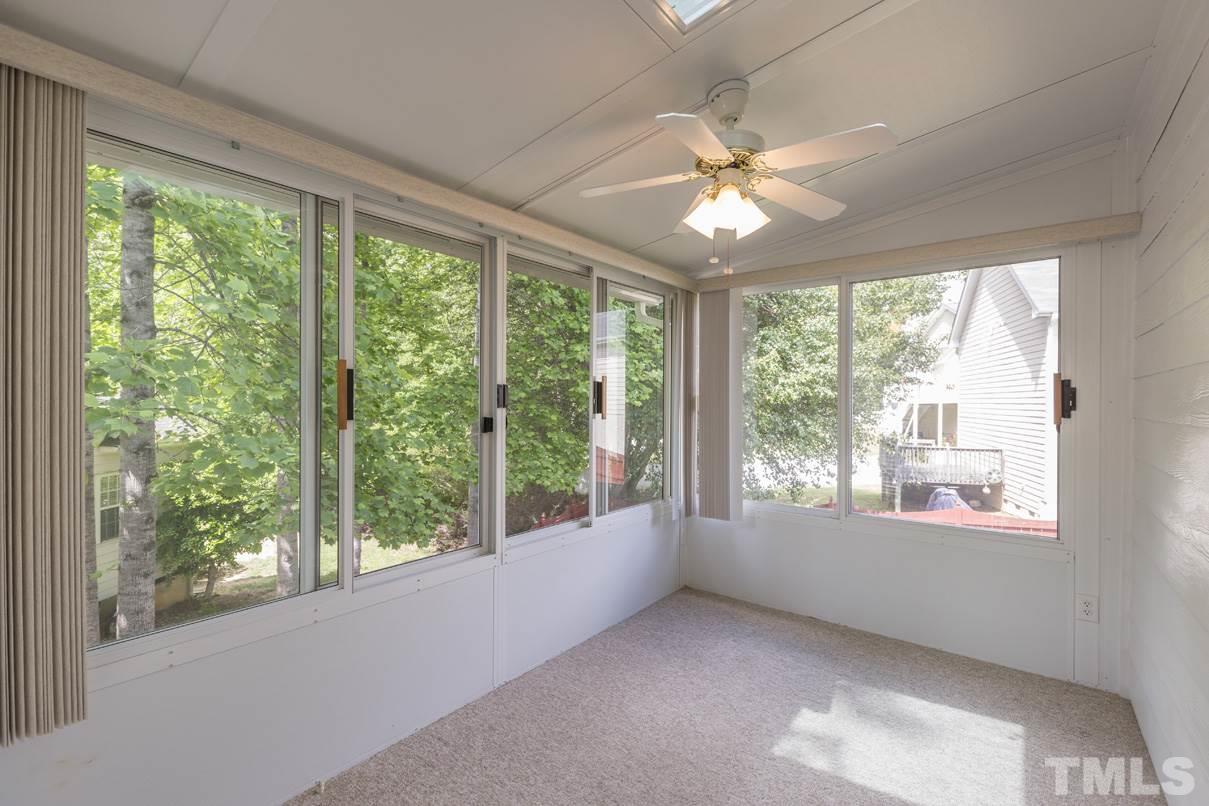 826 Shackleton Road Apex, NC 27502 - Photo 9 of 24 a view of room with window and ceiling fan