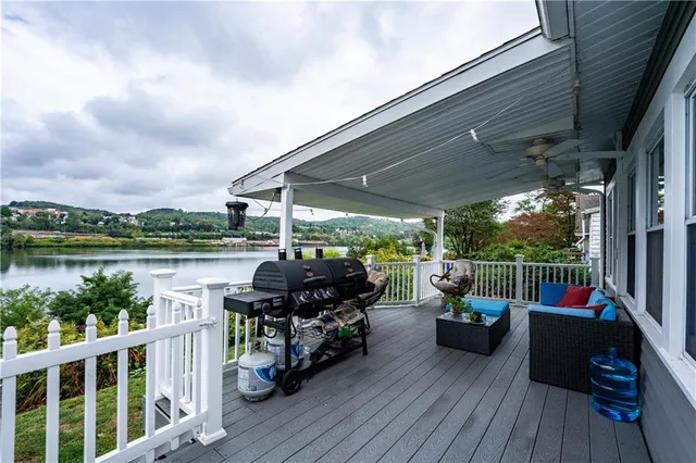 a view of outdoor space with deck and furniture