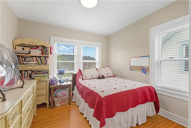 a bedroom with a bed and a dresser