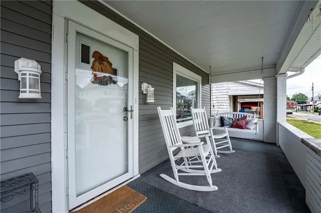a view of a chairs and table in a balcony