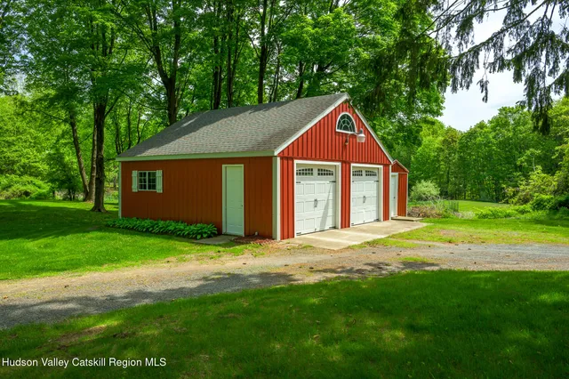 a house with huge green field in front of it