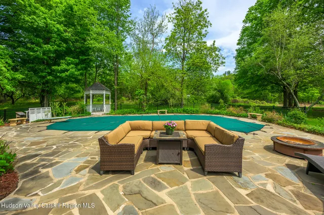 a view of swimming pool with lounge chair