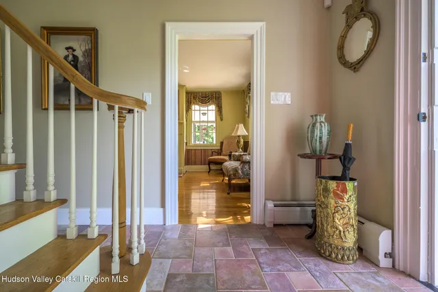a view of a hallway with a livingroom and dining room