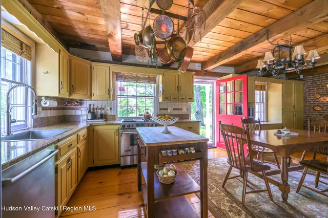 a kitchen with stainless steel appliances granite countertop a sink and cabinets