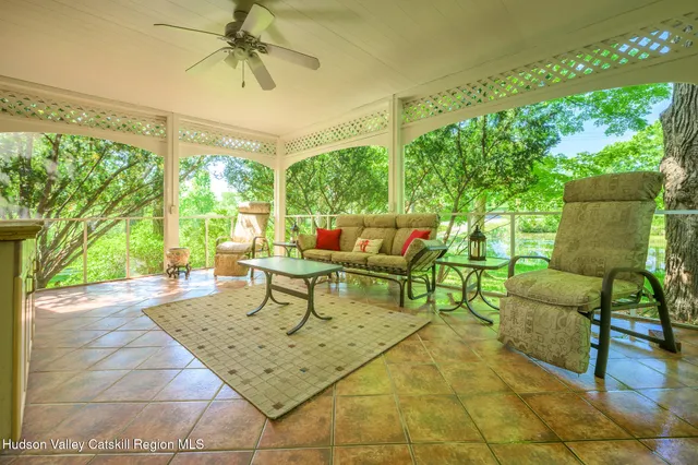 a outdoor living space with furniture and a potted plant
