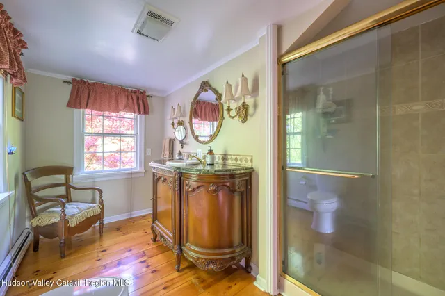 a living room with a toilet and a window