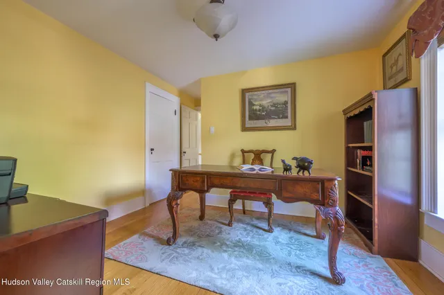 a spacious bedroom with a bed and a window