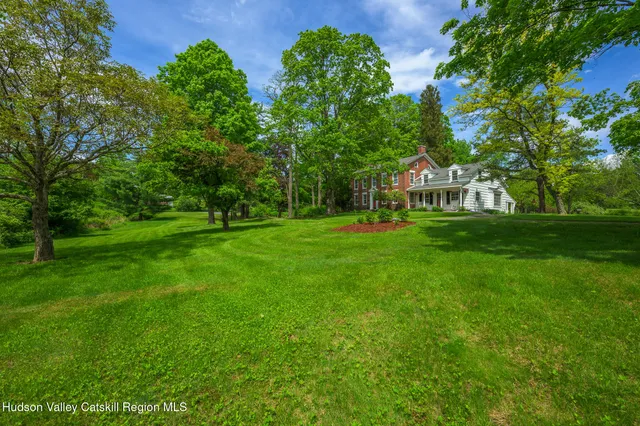 a view of a park with large trees