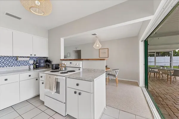 a kitchen with stainless steel appliances a refrigerator sink and cabinets