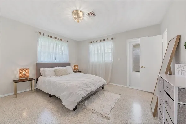 a bathroom with a sink vanity mirror and toilet
