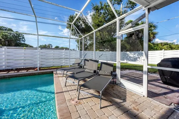 a view of a swimming pool with a patio