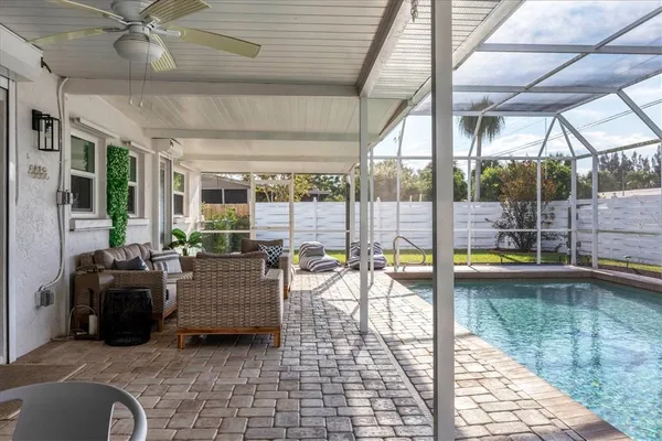 a view of a backyard with swimming pool