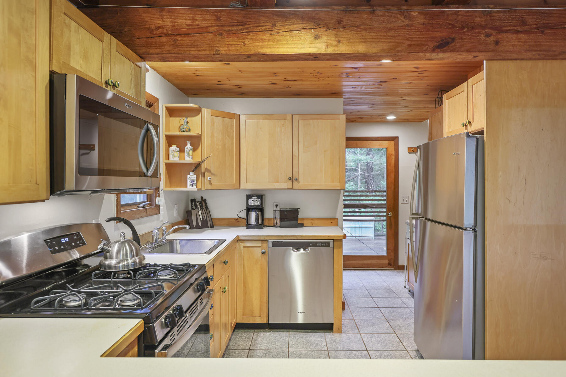 20 Pine Valley Road Wellfleet, MA 02667 - Photo 11 of 52 a kitchen with stainless steel appliances granite countertop a stove a sink and a refrigerator