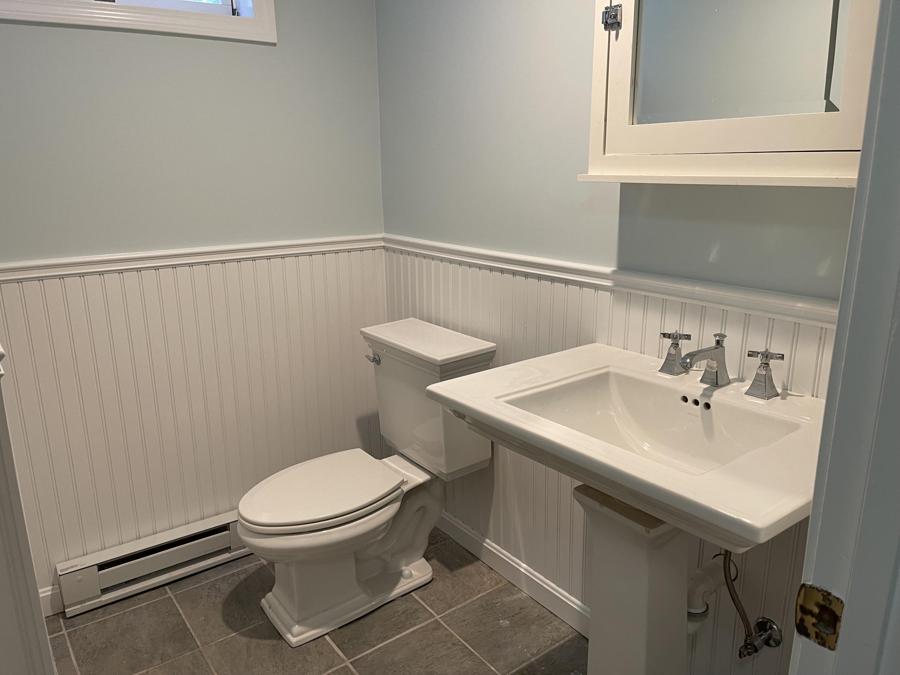 20 Pine Valley Road Wellfleet, MA 02667 - Photo 27 of 52 a bathroom with a sink a toilet and mirror