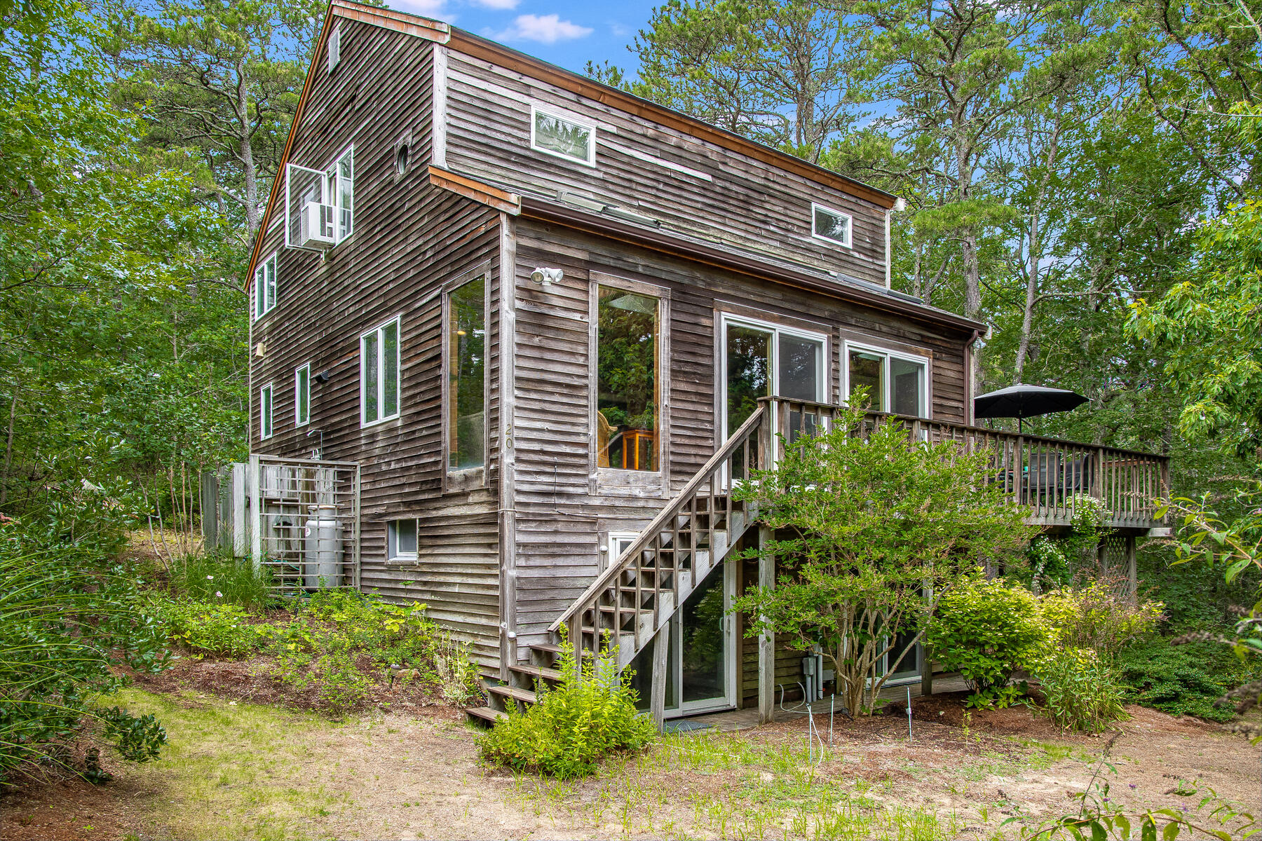 20 Pine Valley Road Wellfleet, MA 02667 - Photo 46 of 52 a view of a house with a yard and plants