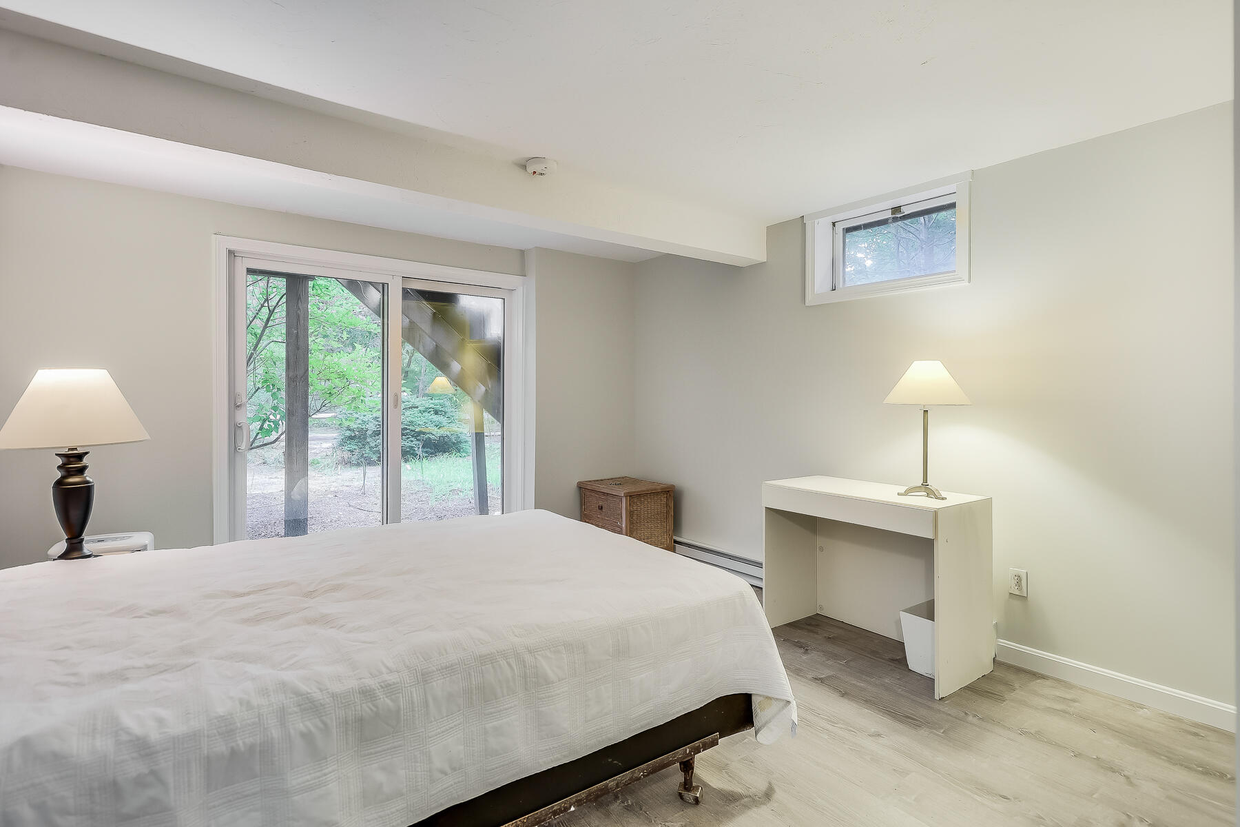 20 Pine Valley Road Wellfleet, MA 02667 - Photo 49 of 52 a bedroom with a bed and a lamp