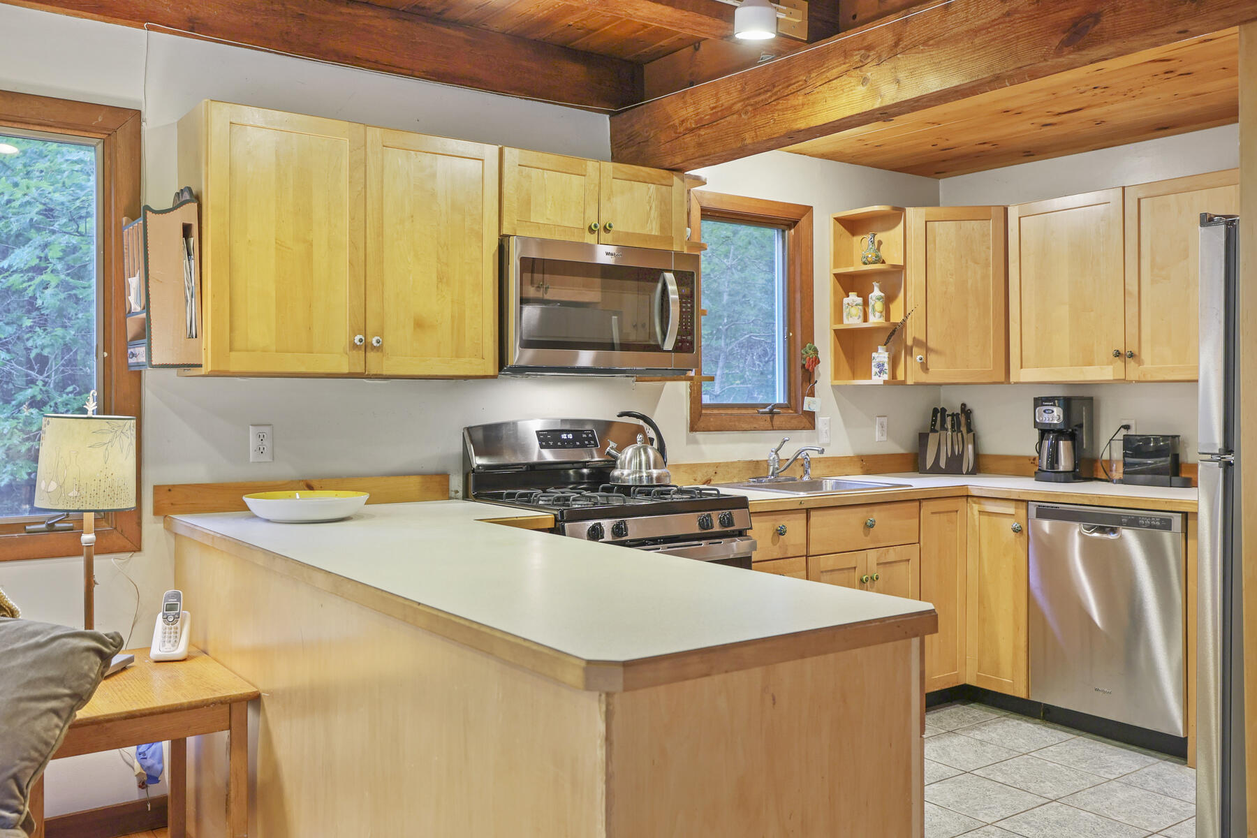 20 Pine Valley Road Wellfleet, MA 02667 - Photo 10 of 52 a kitchen with stainless steel appliances granite countertop a sink stove and refrigerator
