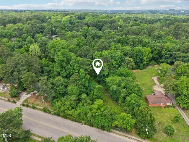 a view of a yard with potted plants