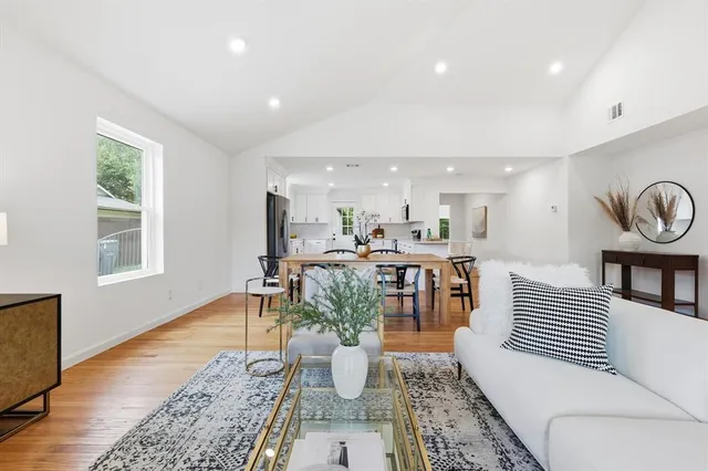 a living room with furniture and a rug