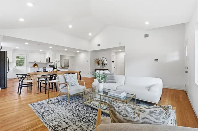 a living room with furniture and a rug