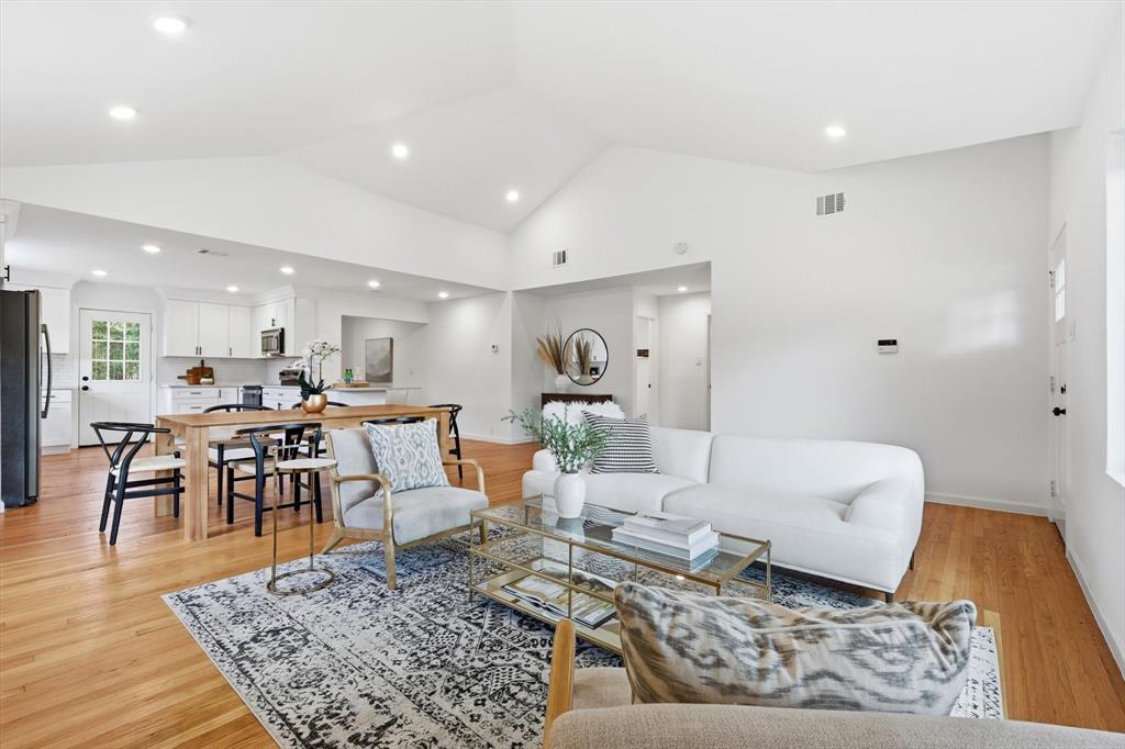 6811 Patrick Drive Dallas, TX 75214 - Photo 12 of 40 Living area with light wood-style flooring, recessed lighting, and high vaulted ceiling