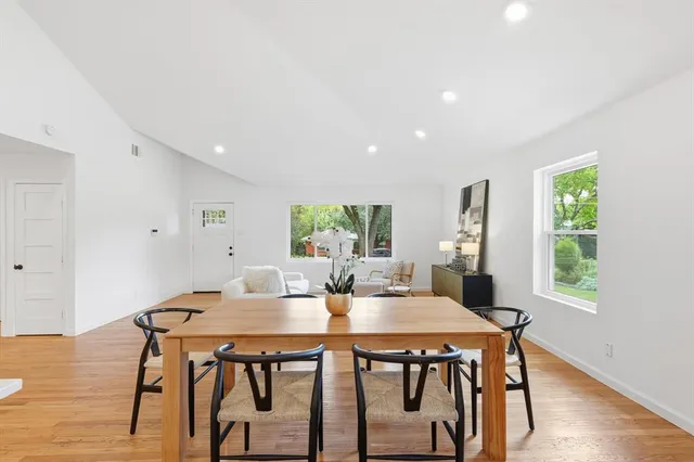 a view of a dining room with furniture window and wooden floor