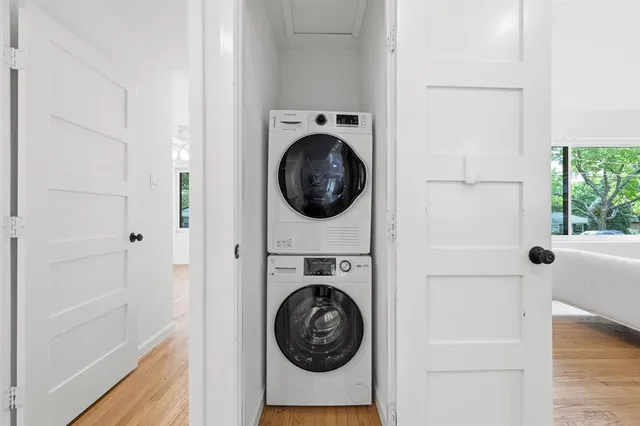 a utility room with sink dryer and washer