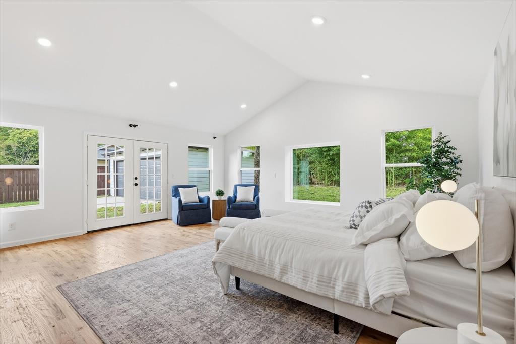 6811 Patrick Drive Dallas, TX 75214 - Photo 25 of 40 Bedroom featuring french doors, recessed lighting, access to exterior, high vaulted ceiling, and light wood-type flooring