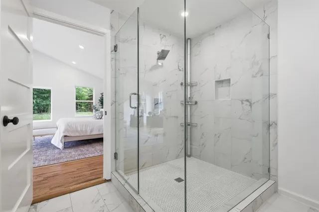 a bathroom with a shower and a bathtub