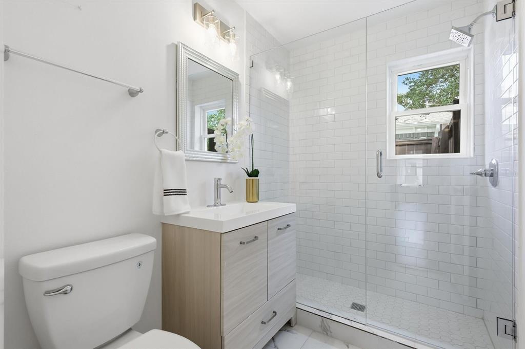 6811 Patrick Drive Dallas, TX 75214 - Photo 37 of 40 Bathroom featuring a stall shower and vanity