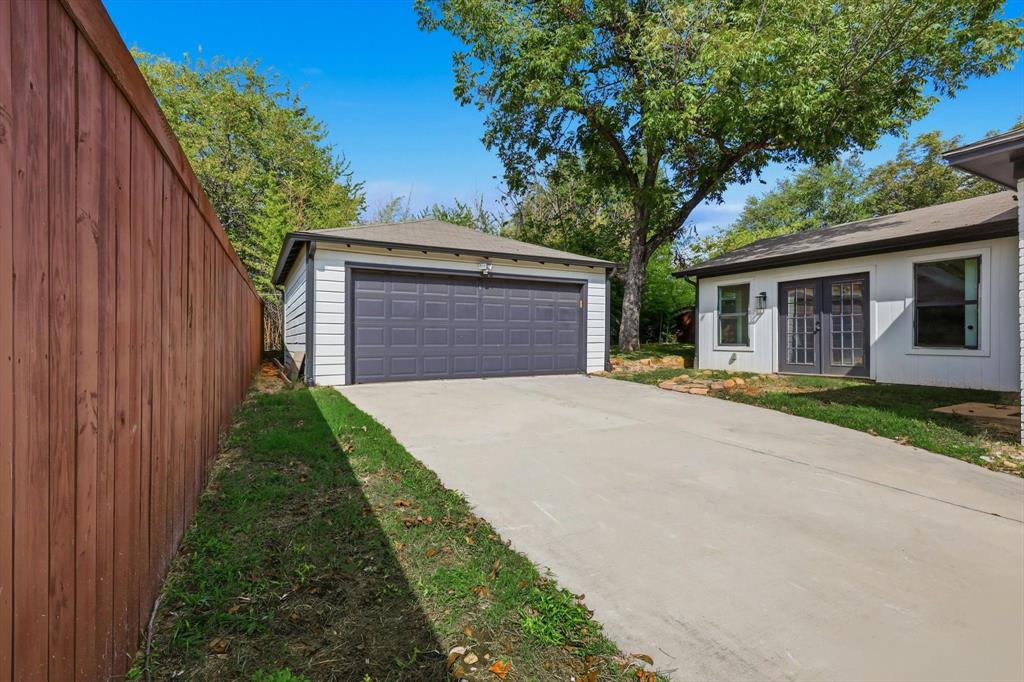 6811 Patrick Drive Dallas, TX 75214 - Photo 40 of 40 Detached garage featuring french doors