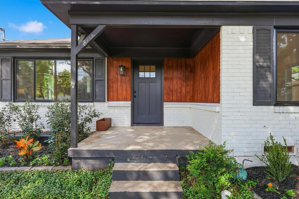 6811 Patrick Drive Dallas, TX 75214 - Photo 4 of 40 Doorway to property featuring brick siding and covered porch