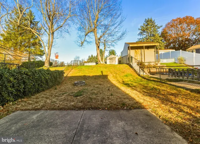 a view of a house with snow on the road