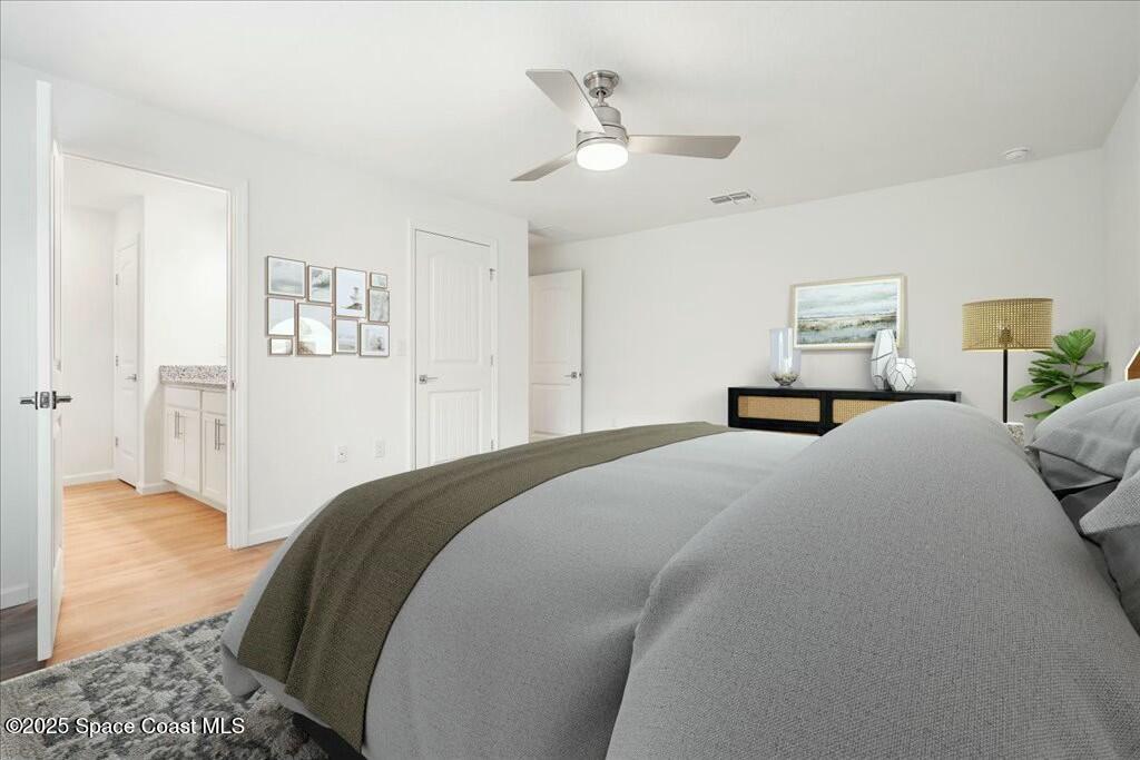 991 Pandora Road Southeast Palm Bay, FL 32909 - Photo 6 of 11 Primary Bedroom & Bath