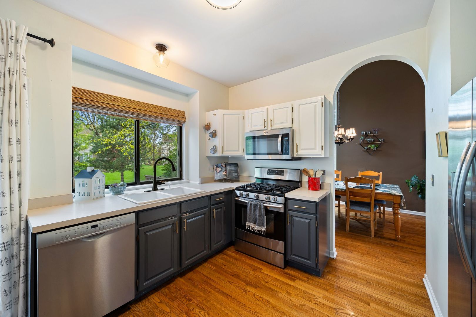 7781 Rippling Ridge Court Gurnee, IL 60031 - Photo 11 of 31 a kitchen with stainless steel appliances granite countertop a stove and a sink