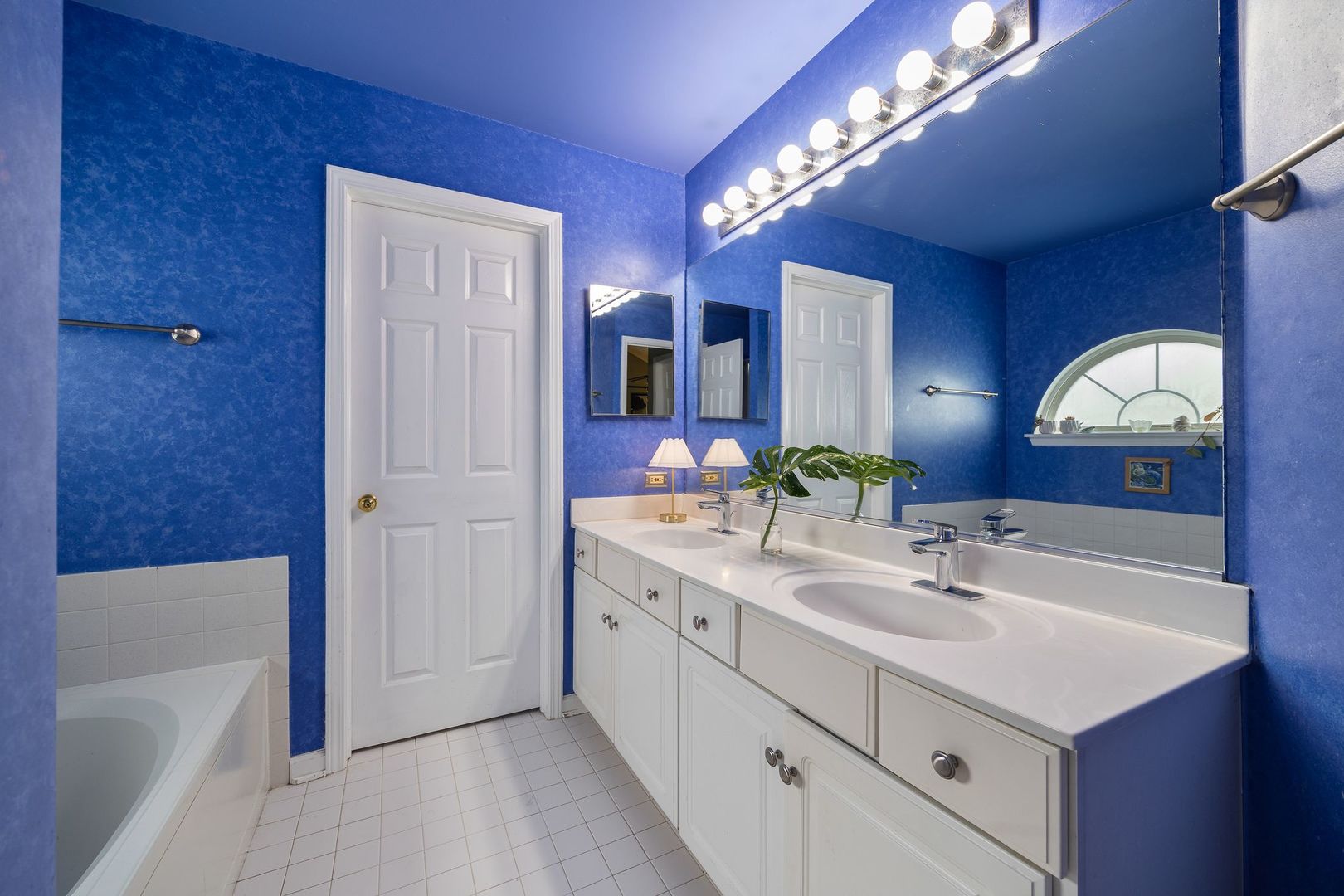 7781 Rippling Ridge Court Gurnee, IL 60031 - Photo 18 of 31 a bathroom with a sink double vanity granite tub and a mirror