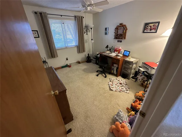 a bedroom with a bed and cabinets