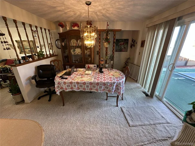 a room with furniture and a chandelier