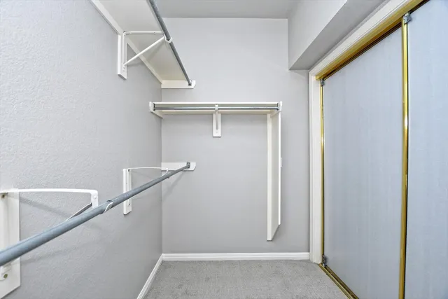 a bathroom with a tub a sink and a mirror