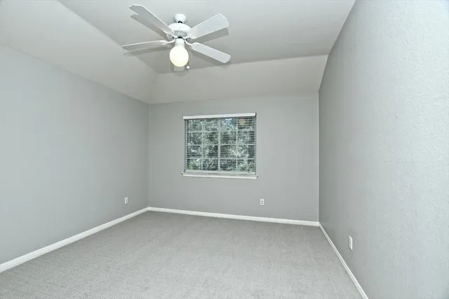 a bathroom with a granite countertop toilet a sink and bathtub