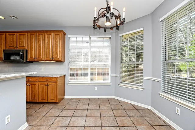 a view of an empty room with windows