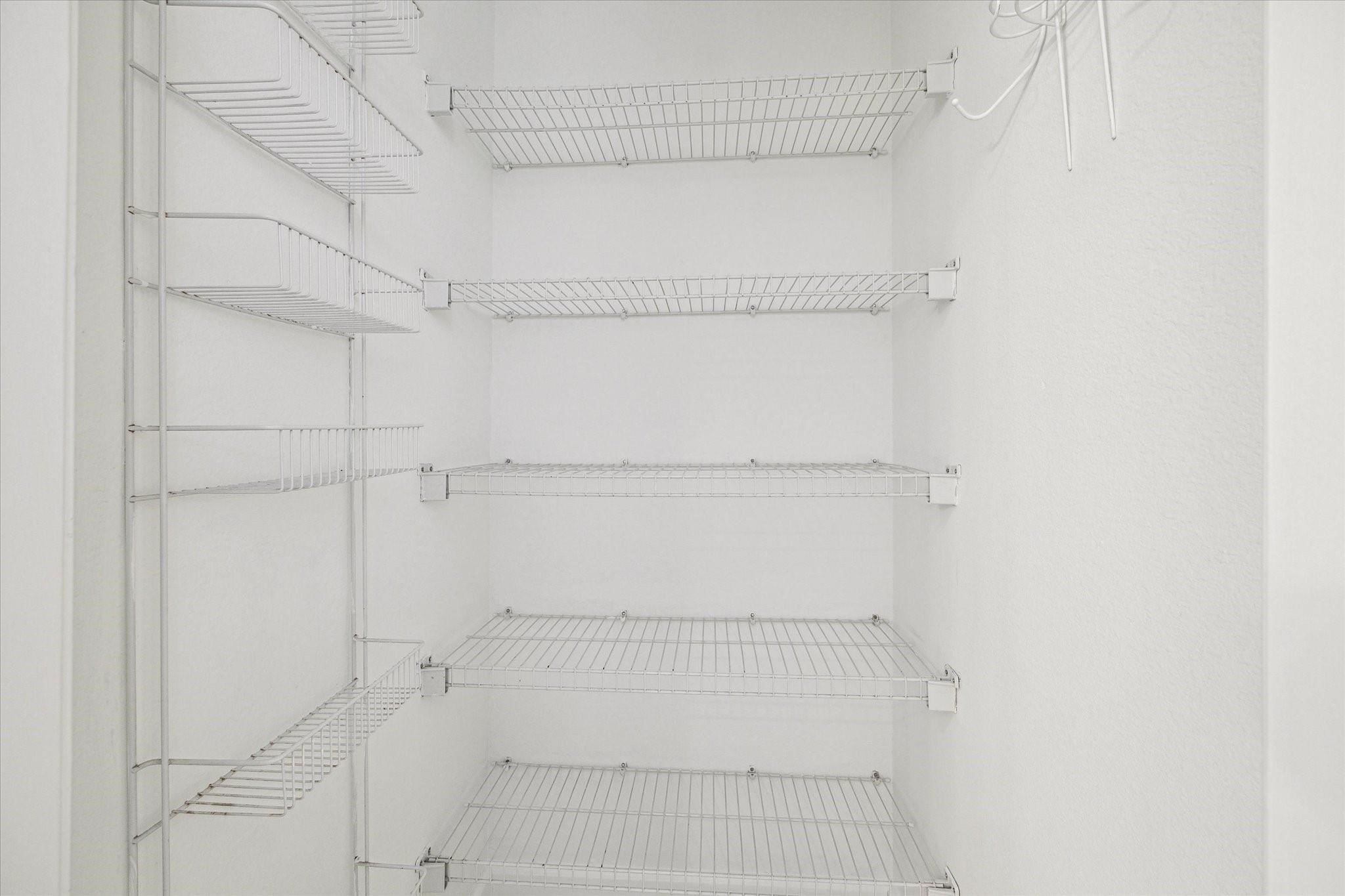 2950 Valiant Scene Court Houston, TX 77038 - Photo 12 of 21 a view of walk in closet with empty racks