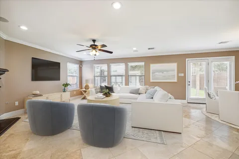 a living room with fireplace furniture and a flat screen tv
