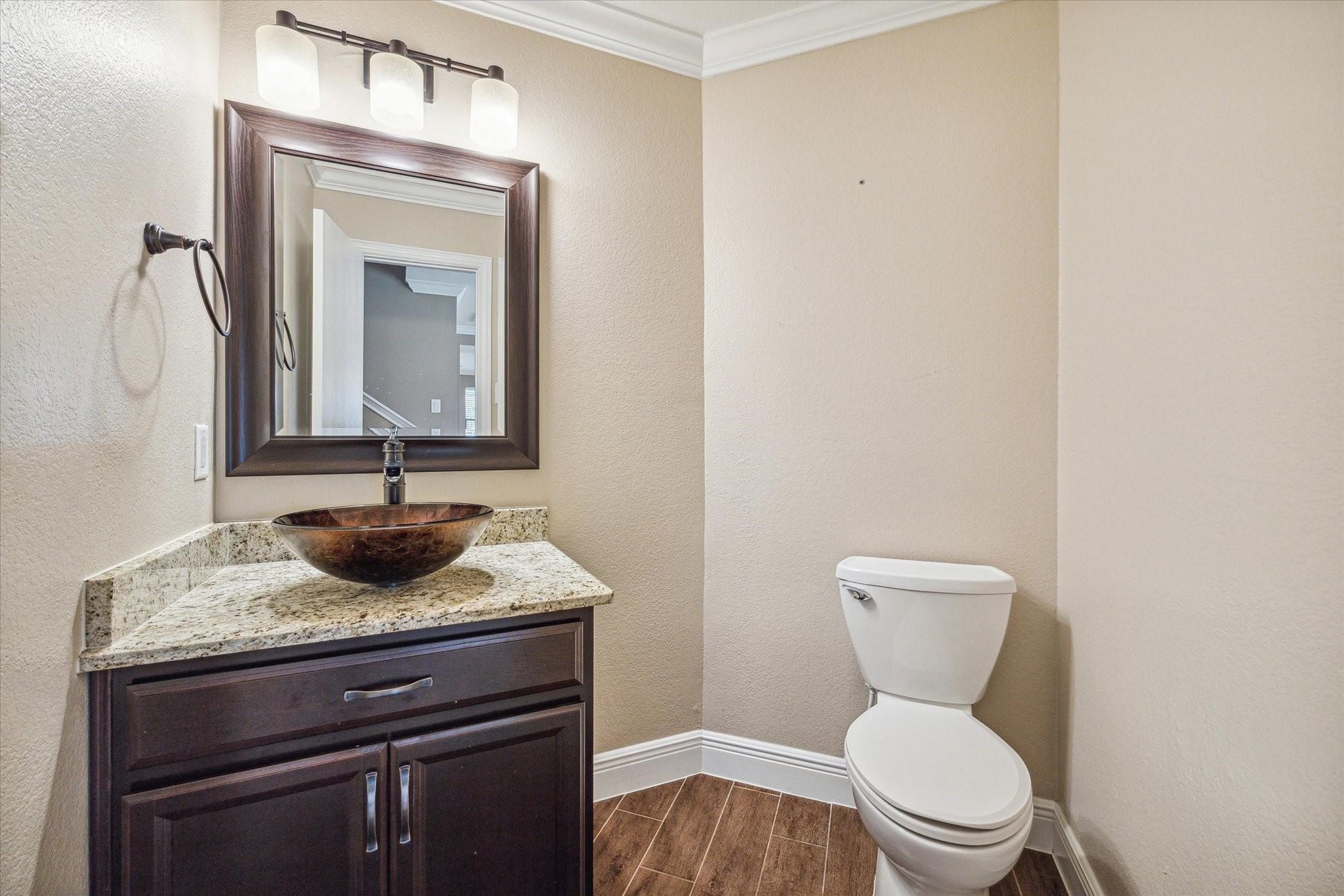 2950 Valiant Scene Court Houston, TX 77038 - Photo 9 of 21 a bathroom with a toilet sink and mirror