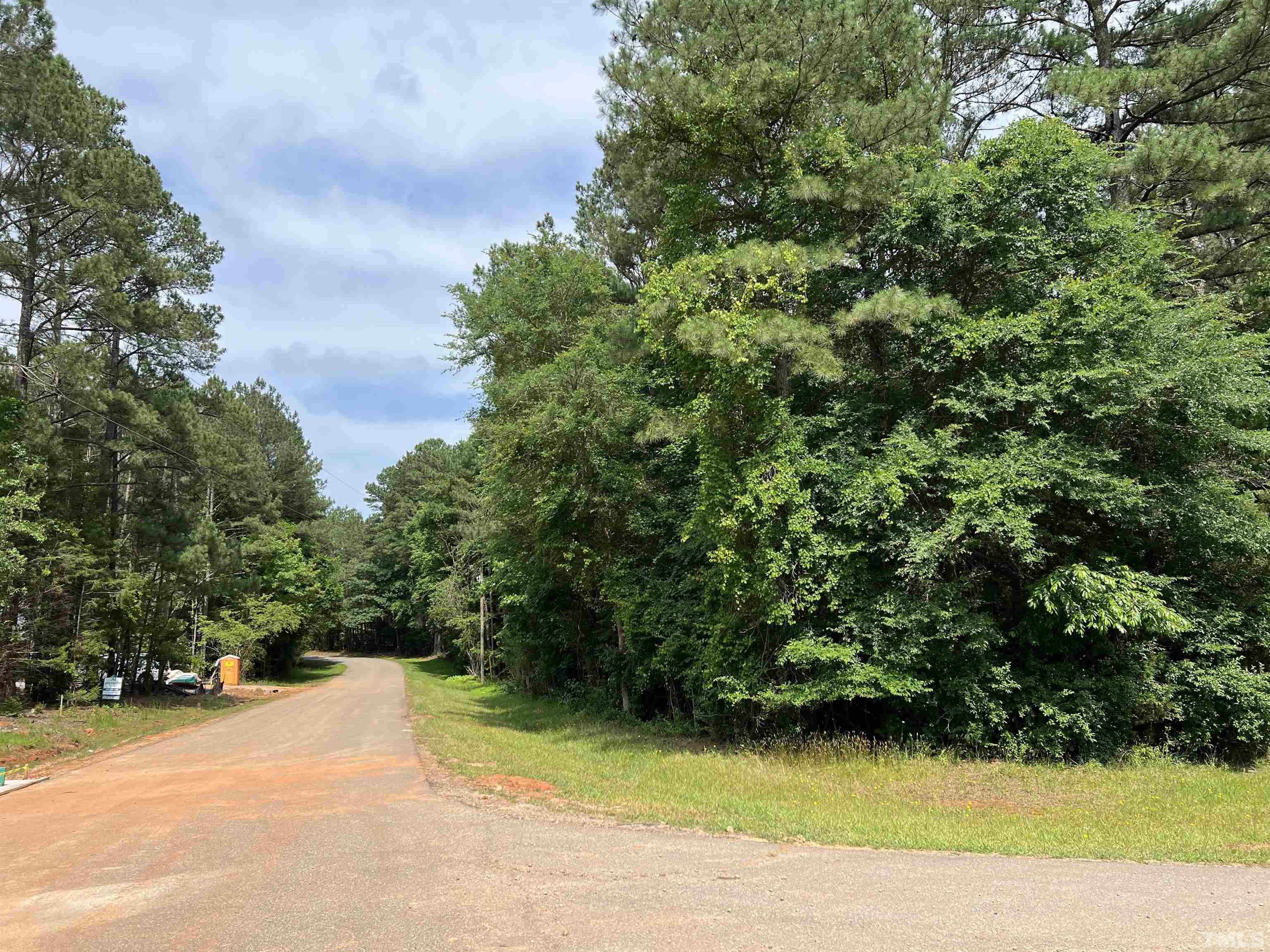 113 Wichita Way Louisburg, NC 27549 - Photo 4 of 5 a view of a yard with plants and trees