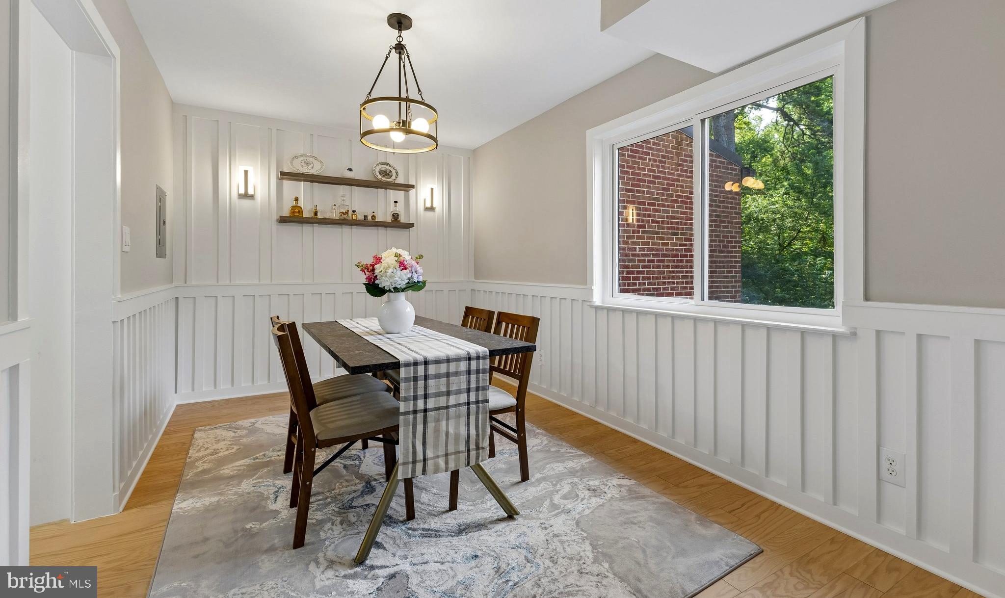 11841 Shire Court, Unit 31D Reston, VA 20191 - Photo 9 of 24 a view of a dining room with furniture window and wooden floor