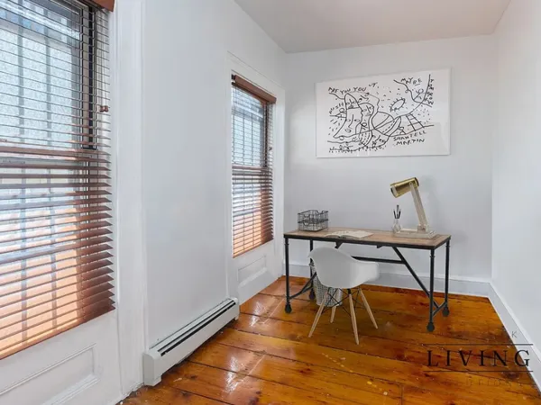 a workspace with furniture and window