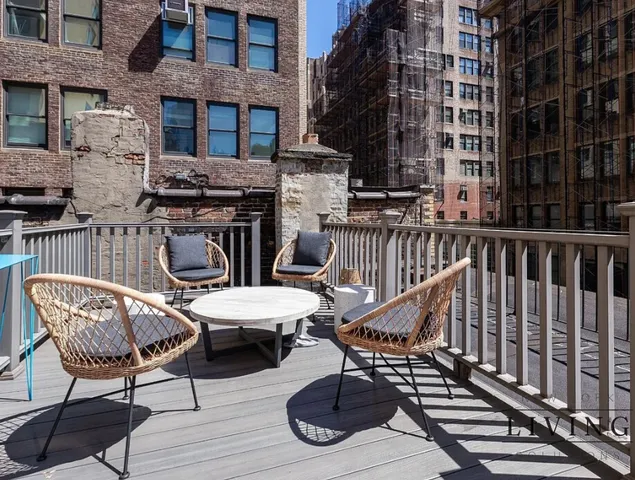 a view of a chairs and tables on the deck
